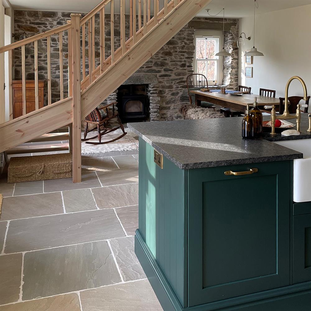 Tudor Brushed Sandstone tiles in a rustic country cottage kitchen and living area